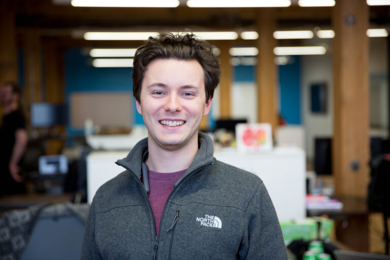Alec Letourneau standing in Punch Through office